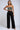A subtle slay rhinestone fringe top and pants two-piece set